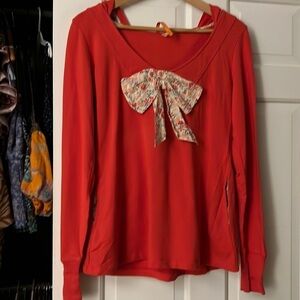 Hooded sweatshirt with bow. Sold by Anthropologie.
